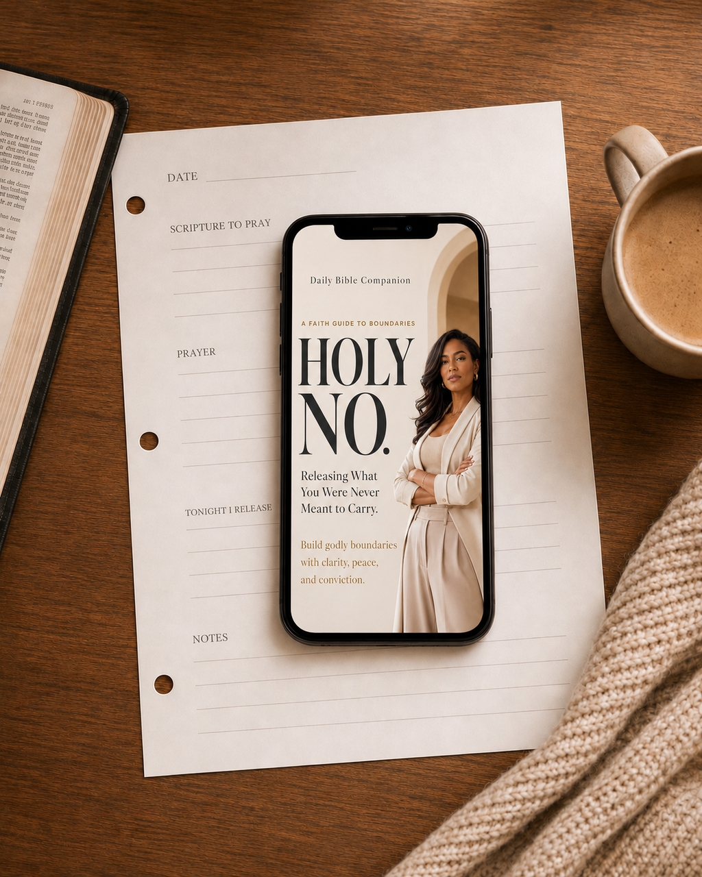 HOLY NO Christian digital guide displayed on a phone over a prayer and scripture reflection worksheet